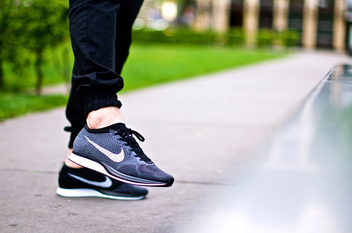 Nike flyknit racer black white on feet best sale