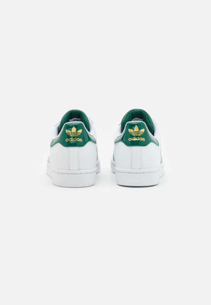 adidas gazelle silver green womens Adidas X Stella McCartney Women's Court Off-White / Core Black / Orange  Slip On Sneakers main image 0