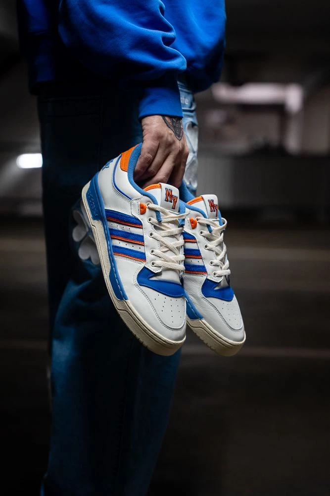 Christopher wears the adidas Rivalry New York Dead Stock