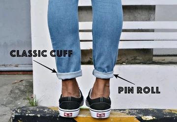 Auf dem Bild sieht man ein Hosenbein welches normal umgekrempelt ist und das andere mit der Pinroll Technik