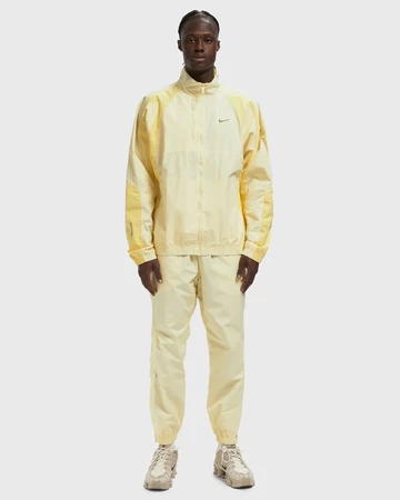 NOCTA x Nike Apparel Yellow Collection Track