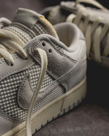 Dunk Low Phantom Light Bone Lookbook Detail Paar Mittelfußbereich