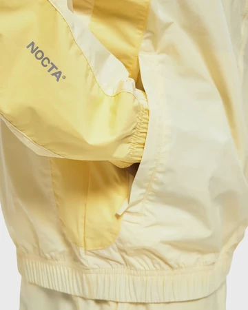 NOCTA x Nike Apparel Yellow Collection Track Details